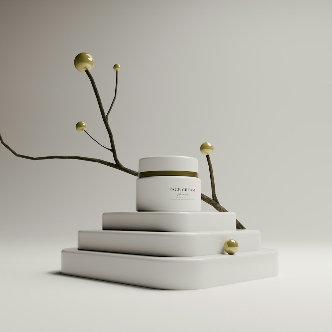 White cream jar with gold accents on tiered display